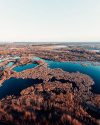 Aerial view of sea against clear sky