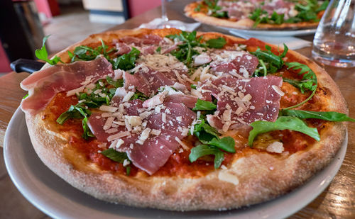 Close-up of pizza in plate on table