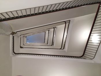 Low angle view of spiral staircase in building