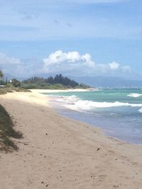 Scenic view of beach against sky