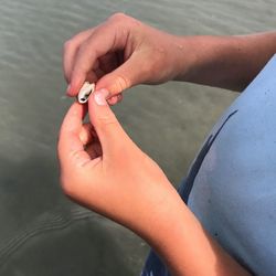 Low section of woman legs in water