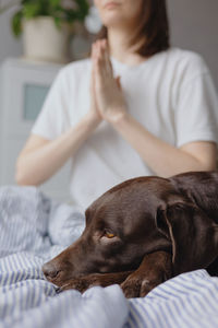 Midsection of woman with dog