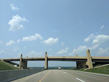 Bridge over road against sky