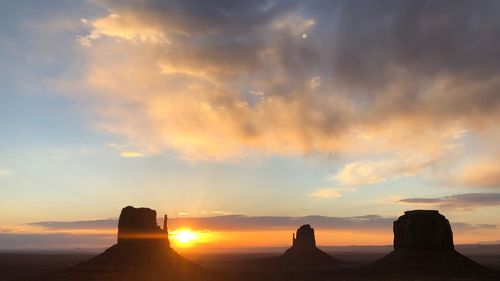 Scenic view of rock formation against sky during sunset