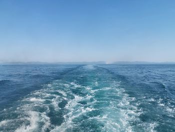 Scenic view of sea against clear blue sky