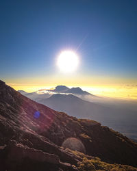 Scenic view of mountains against sky during sunset