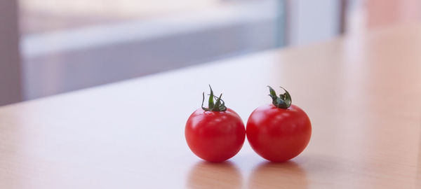 Close-up of cherries on table