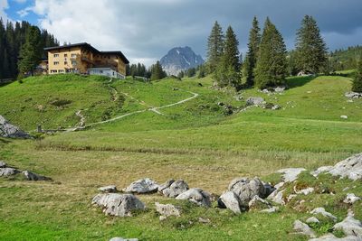 Scenic view of an alpine hotel against sky