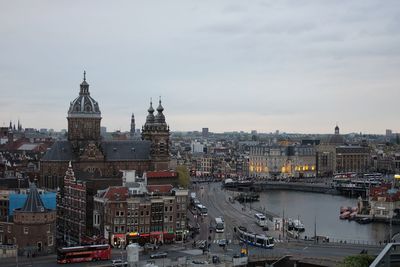 High angle view of city against cloudy sky