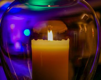 Close-up of illuminated glass against black background