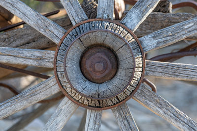Wood wagon wheel with rusty metal