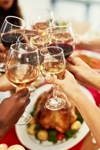 Cropped hand of woman holding wineglass