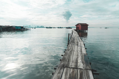 Pier over sea against sky