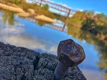 Close-up of rusty metal on rock