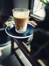 Close-up of coffee cup on table