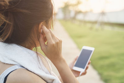 Midsection of woman using mobile phone