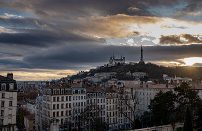 High angle shot of townscape against sky at sunset