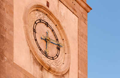 Low angle view of old building against clear sky