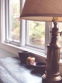 View of wine glasses on window sill