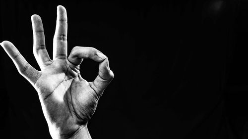 Close-up of lamp over black background