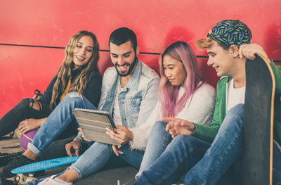 Young couple sitting on table at home
