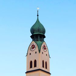 Low angle view of clock tower against clear sky