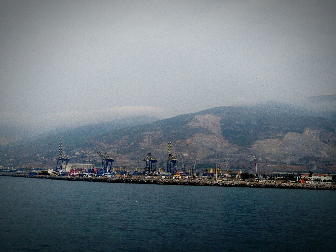 SCENIC VIEW OF SEA BY CITY AGAINST SKY