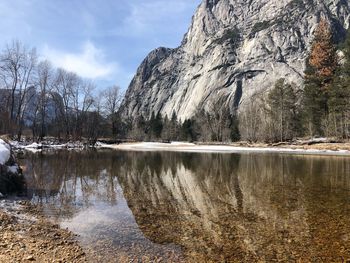 Scenic view of lake against sky during winter