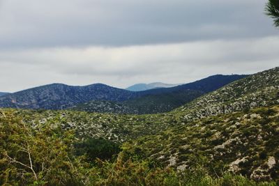 Scenic view of landscape and mountains against sky