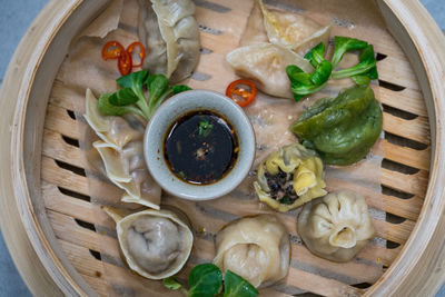 Directly above shot of dumplings in bamboo steamer