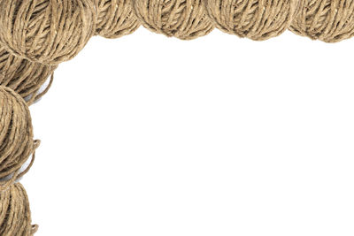 Close-up of rope against white background