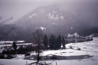 Scenic view of snow covered mountains