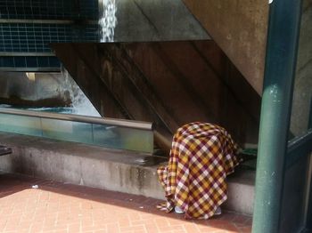 Man standing on built structure