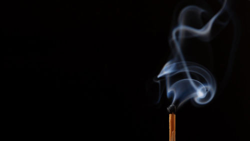 Close-up of smoke against black background