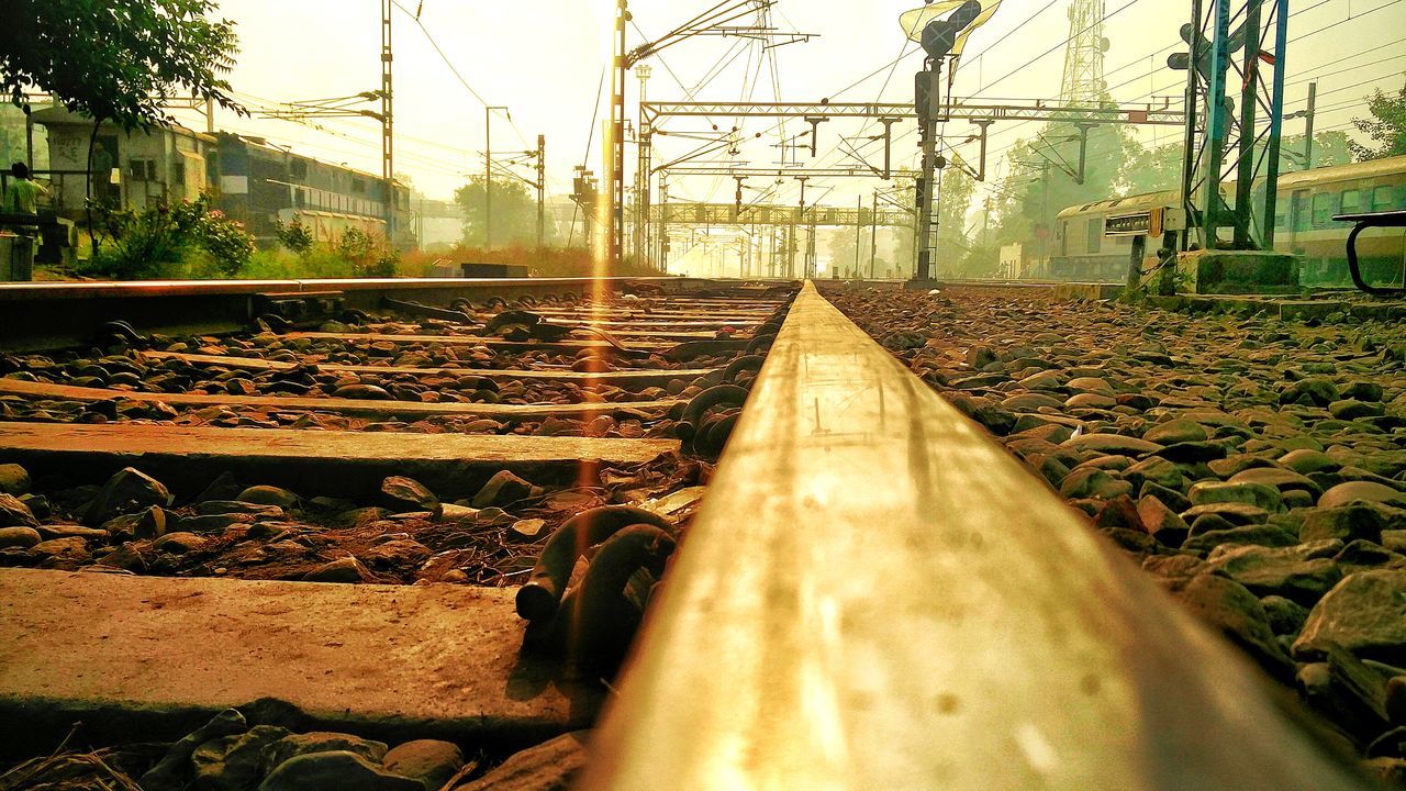 railroad track, rail transportation, transportation, cable, no people, electricity pylon, metal, connection, power line, power supply, railway track, railroad tie, electricity, railroad, day, public transportation, outdoors, close-up