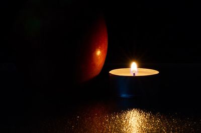 Close-up of illuminated candle