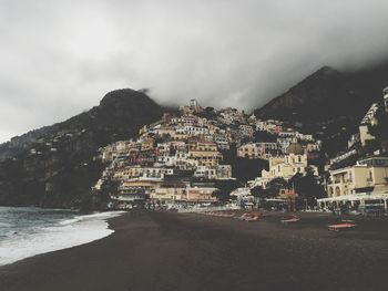 View of city against cloudy sky