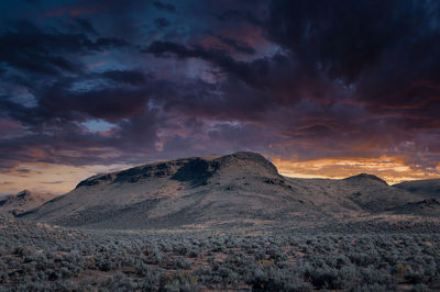 Scenic view of mountains against sky during sunset