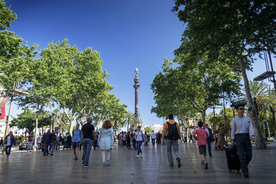 Group of people walking in city