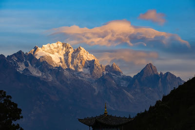 Scenic view of snowcapped mountains against sky