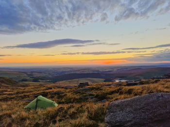 Scenic view of landscape against sky during sunset wild camping 