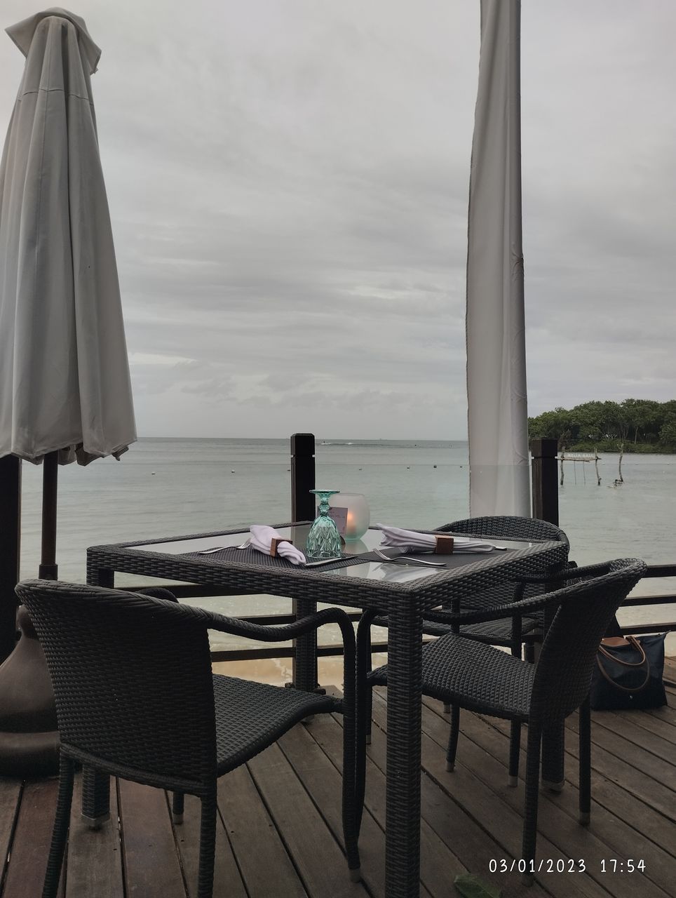 table, chair, seat, sky, water, nature, furniture, no people, sea, absence, interior design, wood, architecture, tranquility, day, cloud, food and drink, room, relaxation, outdoors, beach, land, dining table, luxury, lifestyles, scenics - nature