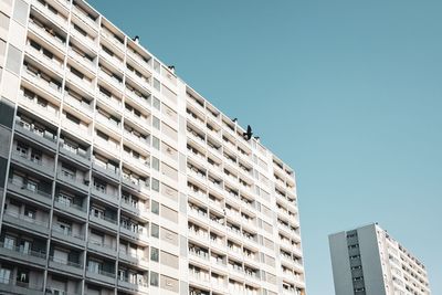 Low angle view of buildings against clear sky