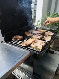 High angle view of meat on barbecue grill