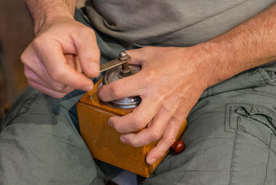 Close-up of man holding hands