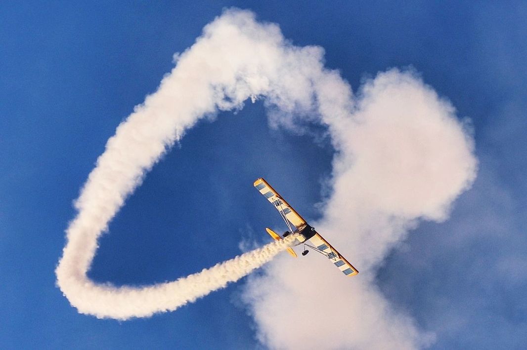 air vehicle, airplane, cloud - sky, sky, vapor trail, flying, airshow, low angle view, smoke - physical structure, on the move, mode of transportation, motion, transportation, no people, military airplane, day, plane, fighter plane, nature, mid-air, outdoors, aerobatics