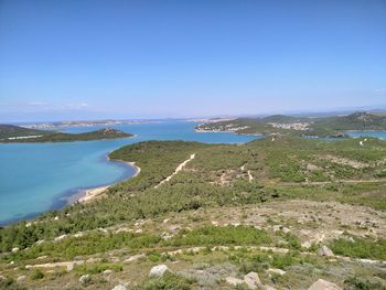 Scenic view of sea against clear blue sky