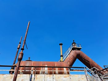 Low angle view of built structure against clear blue sky