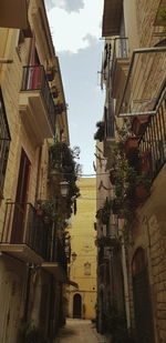 Low angle view of buildings in city against sky