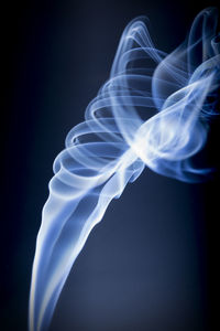 Close-up of blue light against black background